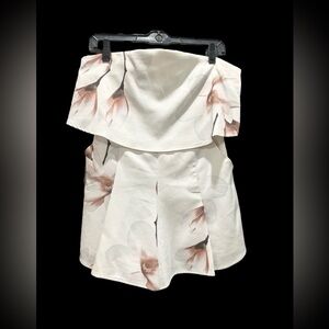 White romper with pockets. Off the shoulder, zipper back.